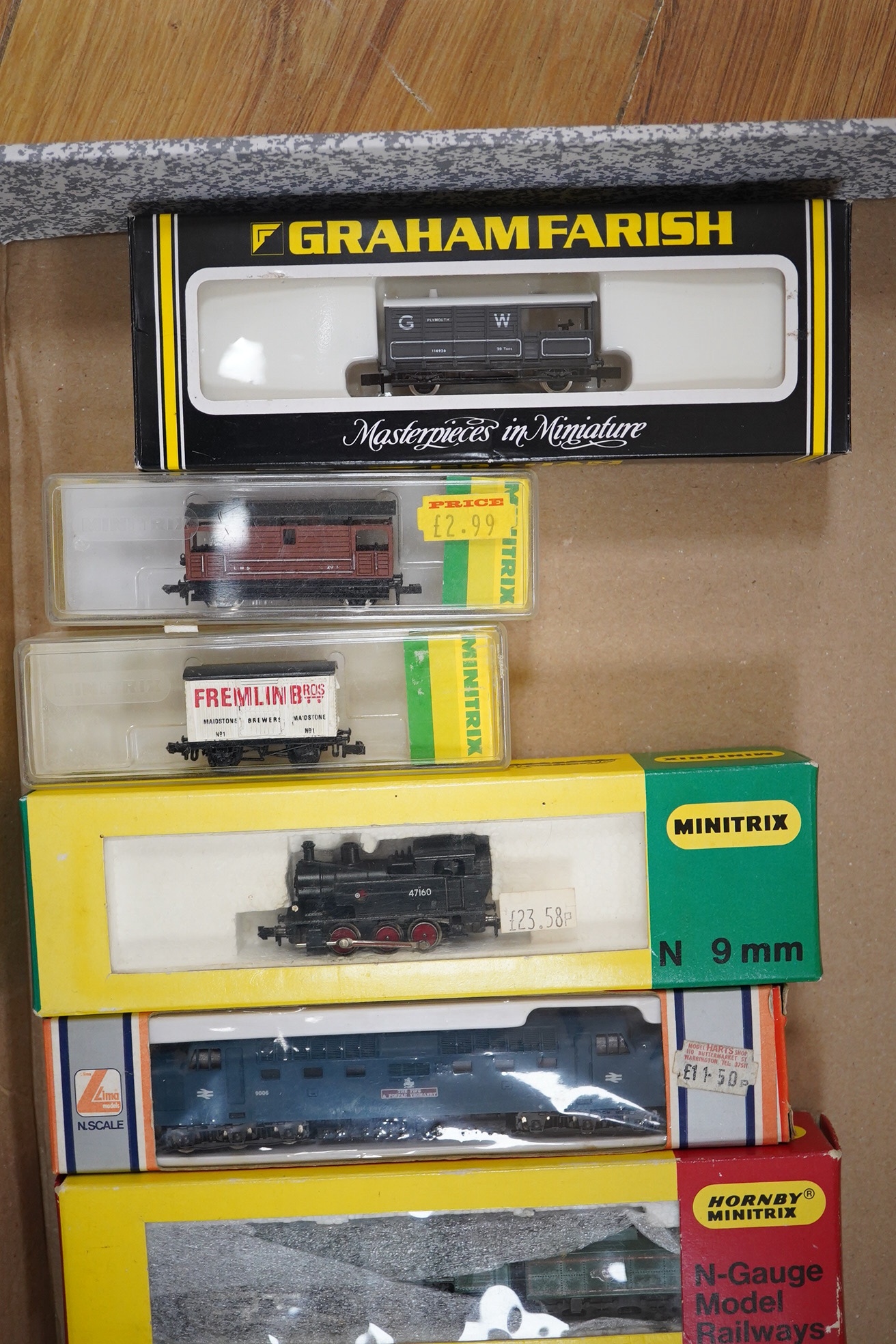 Nineteen boxed N gauge railway items by Graham Farish, Minitrix, etc., including five locomotives; a BR Class 9F, an LMS Class 4F, a BR Britannia Class, a BR Deltic Co-Co diesel, and a BR 0-6-0T, together with seventeen